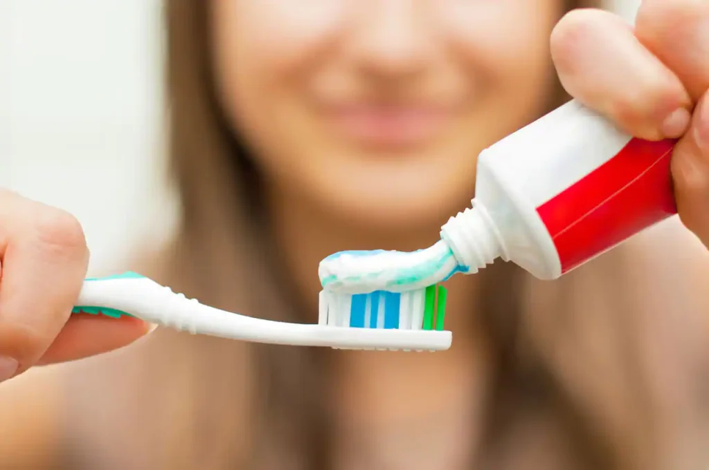 Toothpaste for sensitive teeth and toothbrush
